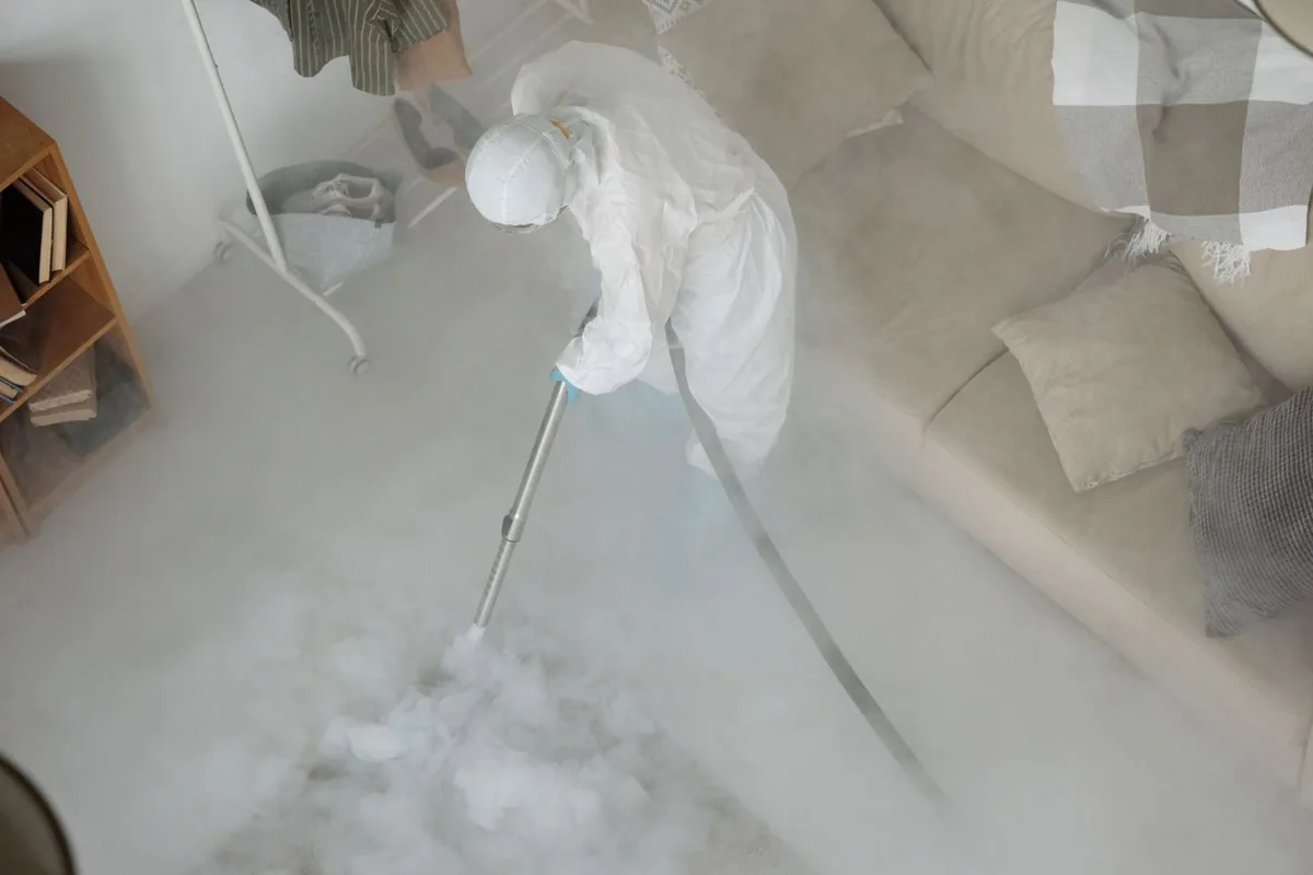 Biohazard cleanup technician in protective equipment, Lennox, CA